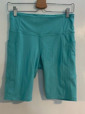 Athleta Ultimate Stash II Teal 9” Active Bike Shorts Side Waist Pockets